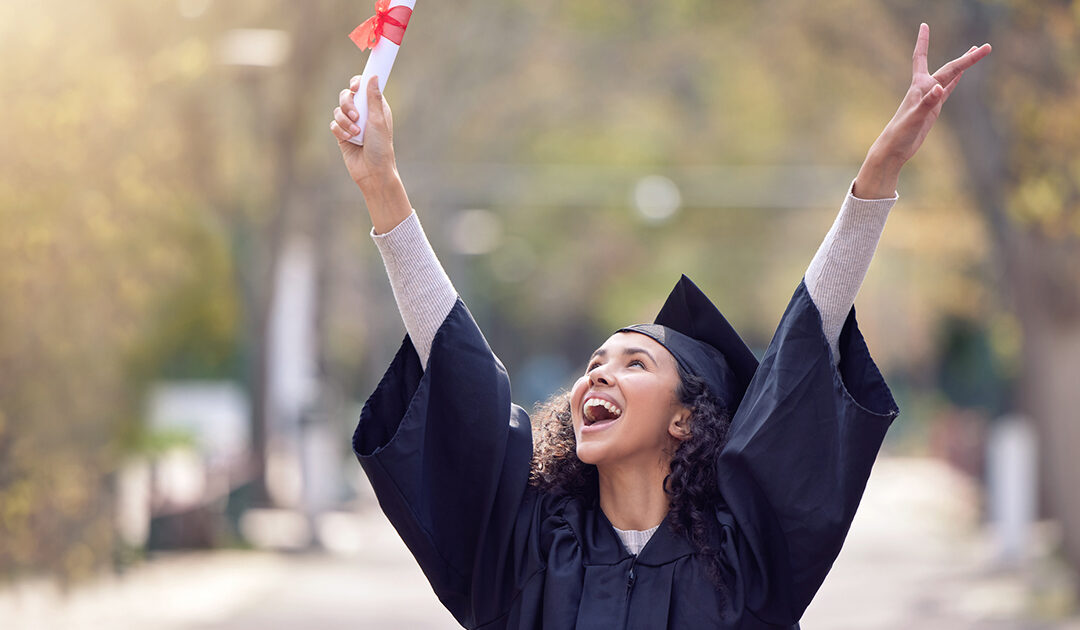 Shot of a young woman cheering on graduation day