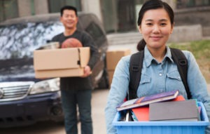 Father helps daughter pack for college