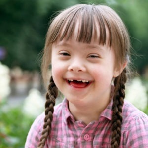 Smiling girl with down syndrome