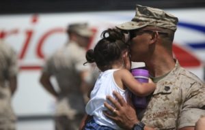 Military dad holding baby