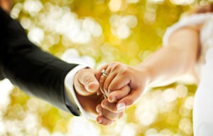 Couples' hands on their wedding day